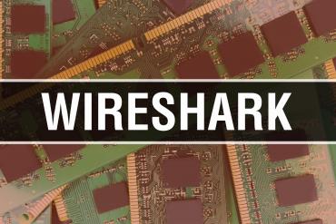 Wireshark logo on computer chip background.